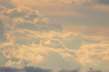 Blue sky with a fluffy white clouds use for background or wallpaper.