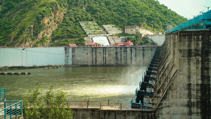 Bisalpur dam, Kota, Rajasthan, India. Hydroelectric dam on the river, water discharge from the reservoir. Water flowing down water reservoir lake dam sustainability renewable green hydro power