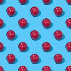Seamless background with plums