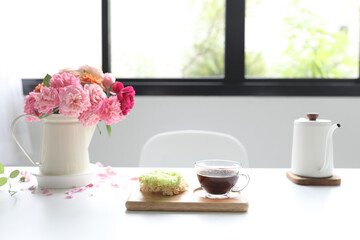 Glass of coffee and Rice Cracker and vase of roses breakfast relaxing