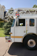closeup of white fire truck cabin with ladders