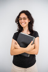 Girl student with a black paper notebook. Calm happy school girl isolated