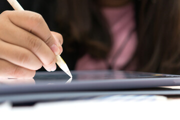 Businesswoman writing stylus pen note on digital tablet computer for E-learning education online learning, Using smartphone training coding application Developing program in meeting room.