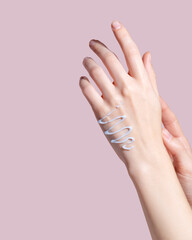 Cosmetic cream on female hands. Woman applying organic moisturizing hand cream.