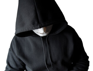A portrait of an anonymous hacker wearing a mask and a black hoodie sitting with his head tilted and terrifying with clipping path. Hacking and malware concept.