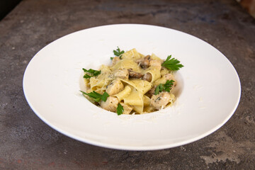 Fettuccine chicken with mushrooms in cream sauce