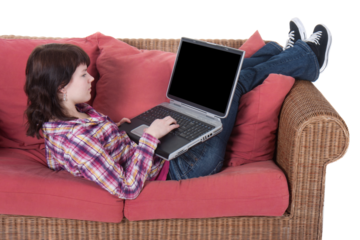 Girl working on her laptop isolated on white