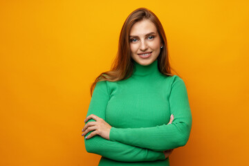 Pretty young woman smiling over yellow isolated background