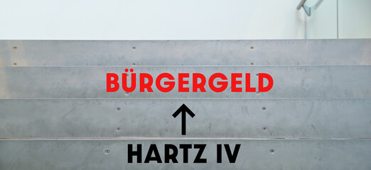 Sign arrow text Hartz IV to Buergergeld. Words at stairs office. climbing stairs to changes for the unemployed in germany. Citizens allowance, Supplementary Welfare Allowance instead of Hartz IV conc