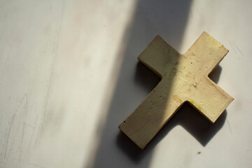 flatly shot of Christian religious symbol white cross on white surface easter holiday background concept ideas 