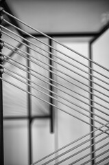 Tightly Strung Parallel Silver Metal Wire with a Black and White Background.