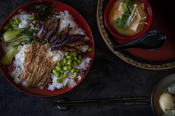 Chirashizushi and miso served in traditional Japanese dishes