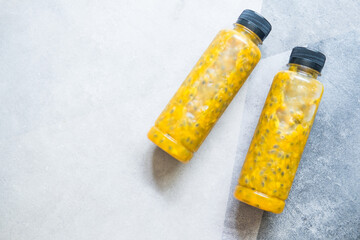 Passion fruit juice in bottle. Juice is a very strong exotic flavor