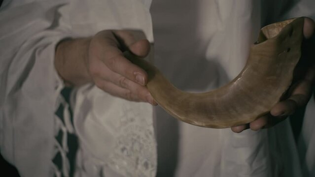 Jewish Man holding a Shofar
