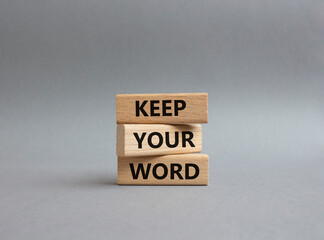 Keep your word symbol. Wooden blocks with words Keep your word. Beautiful grey background. Business...