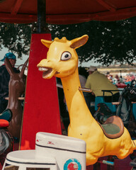 weird scary giraffe amusement ride 