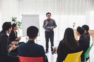 The supervisor is presenting business plans to employees in the company