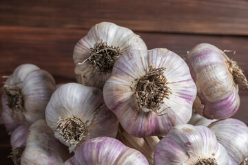 Garlic Cloves and Bulb on vintage wooden boards.