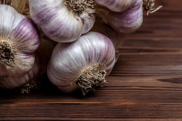 Garlic Cloves and Bulb on vintage wooden boards.