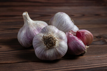 Garlic bulb on wooden background close up