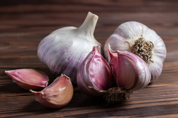 Garlic bulb on wooden background. Close up