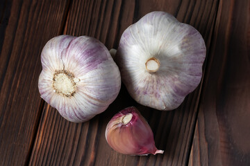 Garlic bulb on wooden background close up