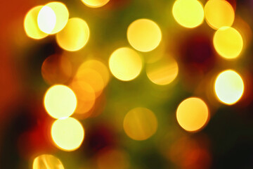 Blur light celebration on christmas tree with brown wall background