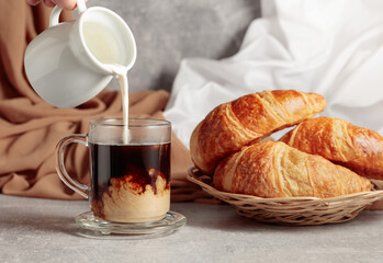 Fototapeta na wymiar Croissants and coffee with cream.