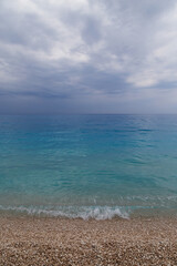 Dark stormy dramatic sky over Ionian sea. Myrtos Beach, Cephalonia island, Greece, Europe.