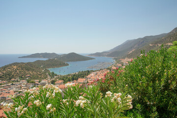 :  Charming view of seaside resort town of Kas in Turkey. Romantic harbour with yacht marina and mosque with minarets