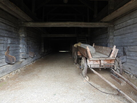 old farm barn with a wooden wagon
