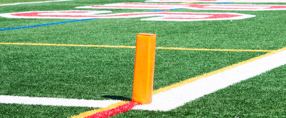 Orange pylon marking the end zone for a football game