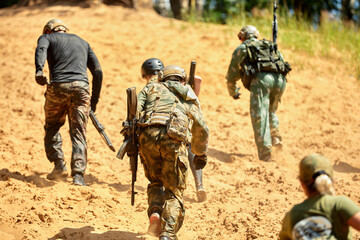 Young military soldiers during military maneuver training