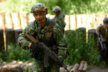 Young military soldiers during military maneuver training