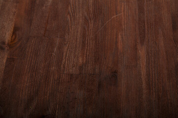 Dark brown wooden background smooth even texture.