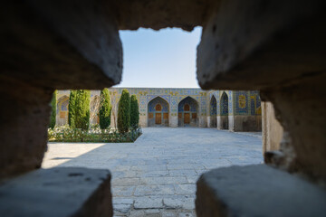 The majestic architecture of the city of Isfahan in Iran seen from a cross-shaped window