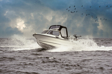 Sportsfishingboat in the waves