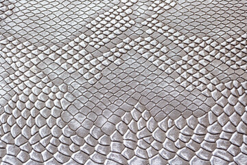 Beautiful white bright python skin, reptile skin texture, snake skin close-up as a background.