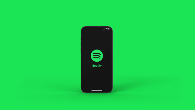 Spotify music app on the smartphone iPhone 14 Pro screen. Green background. Rio de Janeiro, RJ, Brazil. September 2022