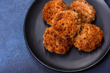 Delicious fresh ground beef patties with onions in breadcrumbs