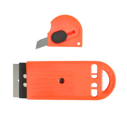 2 Orange stationery knives isolated on white background close up