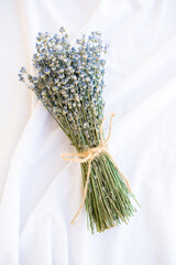 Lavender as an ingredient. a bouquet of dried lavender tied with string on a white background