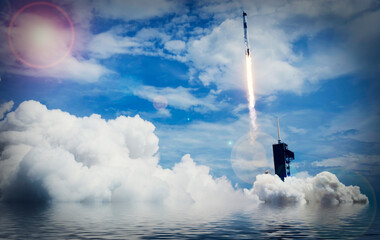 Dramatic rocket launch and a water reflection.The elements of this image furnished by NASA.