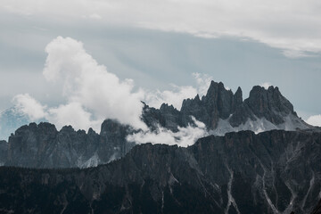 clouds over dolomtes mountains