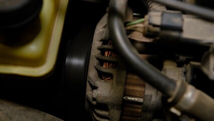closeup car timing belt in car with working engine