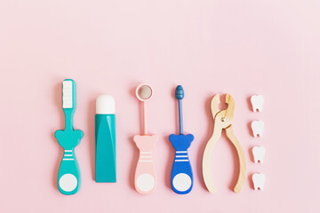 Dental background with wooden toy tools