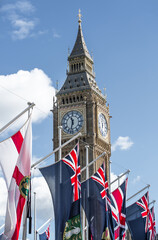 London, UK.  Big Ben, British and commonwealth countries flags during the funeral ceremony of Queen...