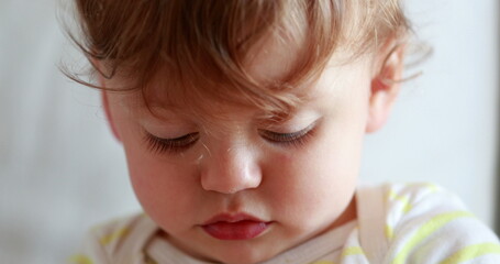 Baby portrait, adorable cute one year old infant toddler boy face