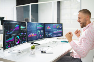 Excited Business Analyst Using Data Dashboard On Computer