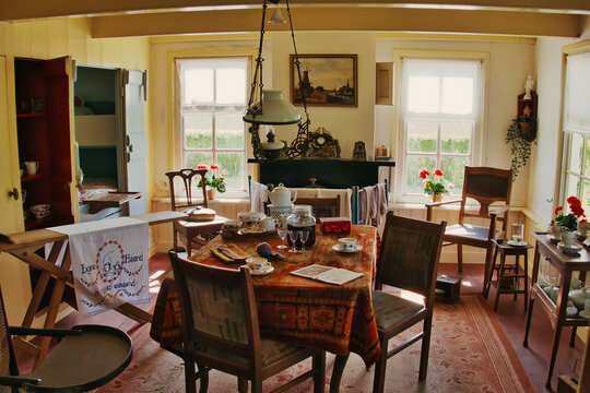 Leens, Netherlands, 4-24-2022. Living room in traditional Dutch style in a 19th-century Dutch farmworker's cottage, with a bedstead and period furniture. Verhildersum, Leens, Groningen.
